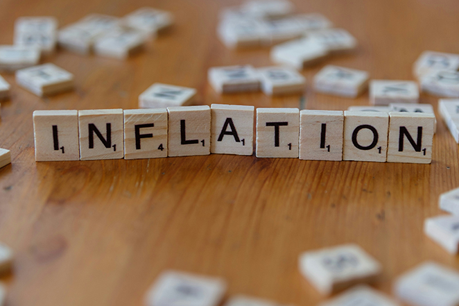 Scrabble pieces assembled to spell Inflation